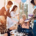 Family members visit grandma at a nursing home to celebrate her birthday