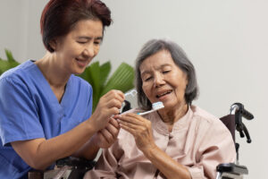 Caregiver takes care of an elderly woman