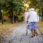 Elderly woman with the walker