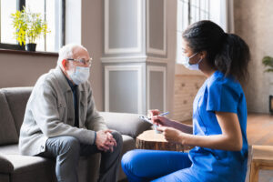 doctor give a consultation to elderly man